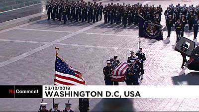 Emotional George W. Bush watches his father's casket arrive at US Capitol