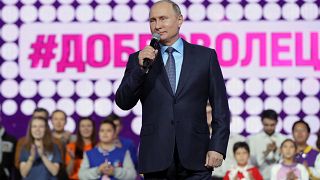 Putin delivers a speech at the International Volunteer Forum in Moscow