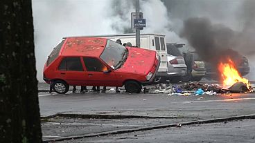 Students clash with police and burn car in Nantes