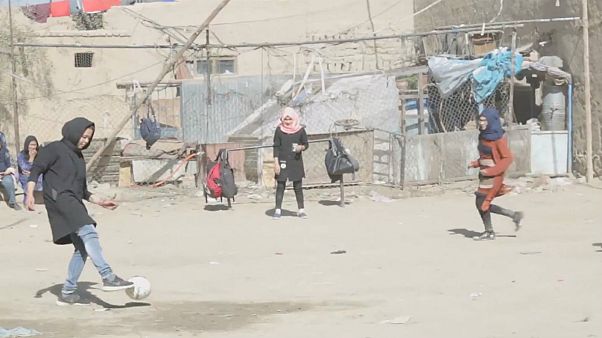 Women play footbal in the streets of Kabul Women play footbal in the streets of Kabul