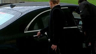 Theresa May prepares to leave her car
