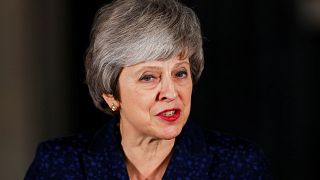 Theresa May heads to Brussels after winning vote of no confidence