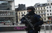 An armed police officer patrols in Stockholm following 2017's attack