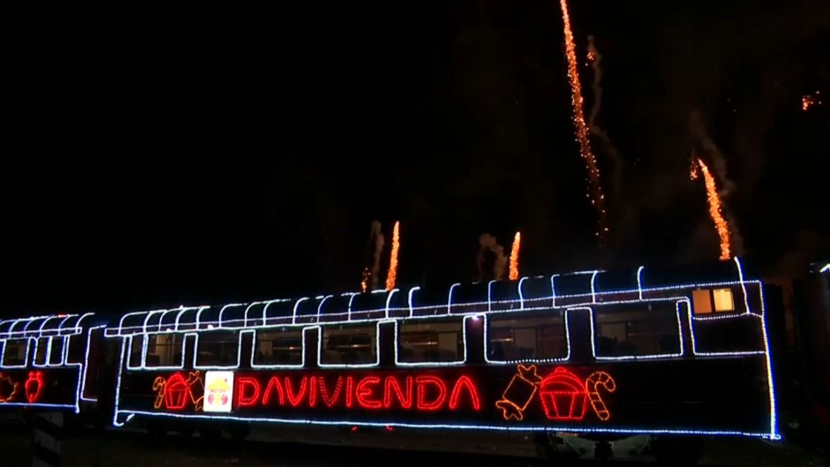 Illuminated train chugs through Bogota bringing Christmas cheer
