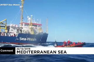 Dozens of rescued migrants stranded at sea wait for safe port