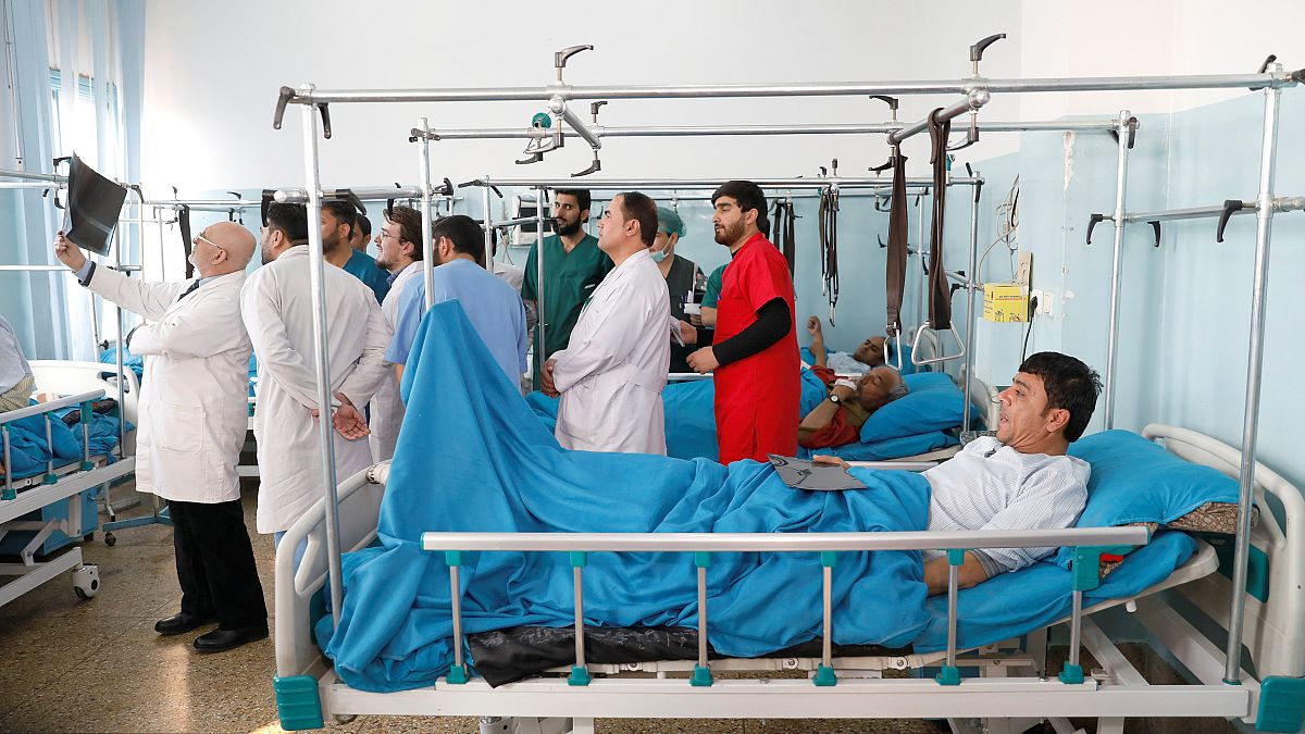 Injured men at the hospital after an attack in Kabul, Dec 25, 2018.