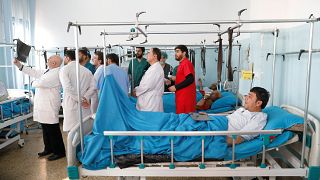 Injured men at the hospital after an attack in Kabul, Dec 25, 2018.