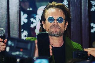 Watch: Bono and The Edge busk to raise money for homeless charity in Dublin