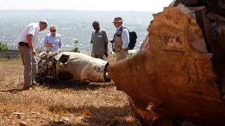 French investigators examine the wreckage of Juvenal Habyarimana's plane