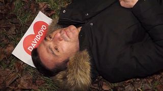 Davor Dragicevic, David's father, lying in place where his son was killed.
