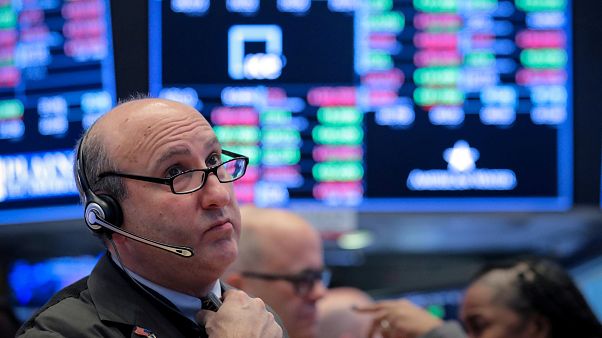 Traders work on the floor of the NYSE in New York Traders work on the floor of the NYSE in New York