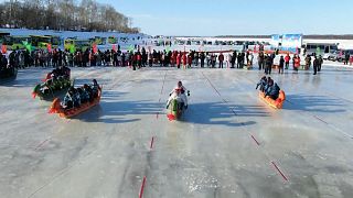 Chinese and Russian dragon boats battle it out on the ice
