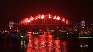 Sydney harbour illuminated by New Year fireworks