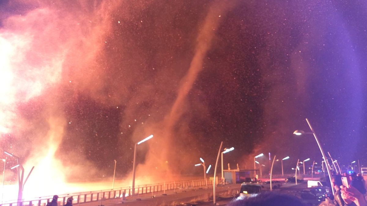 Swirls of fire near a New Year's bonfire in Scheveningen in The Hague