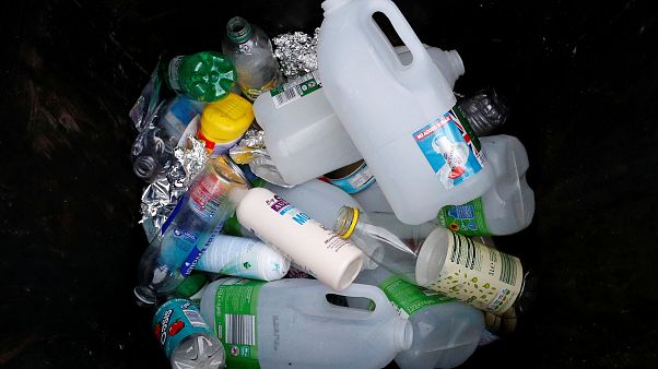 Plastic bottles and containers are seen in a domestic recycling bin Plastic bottles and containers are seen in a domestic recycling bin