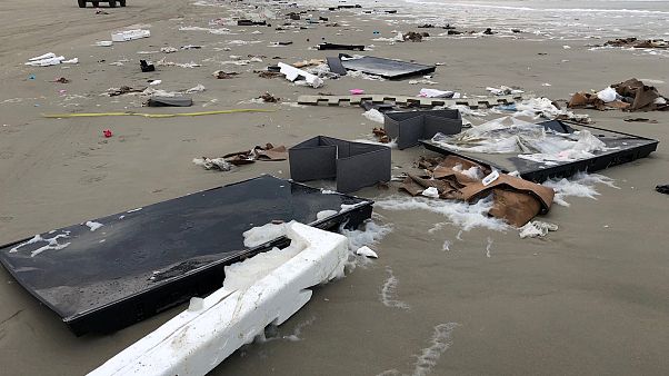 Flat-screen TVs and debris lie washed up on beach in Terschelling Flat-screen TVs and debris lie washed up on beach in Terschelling