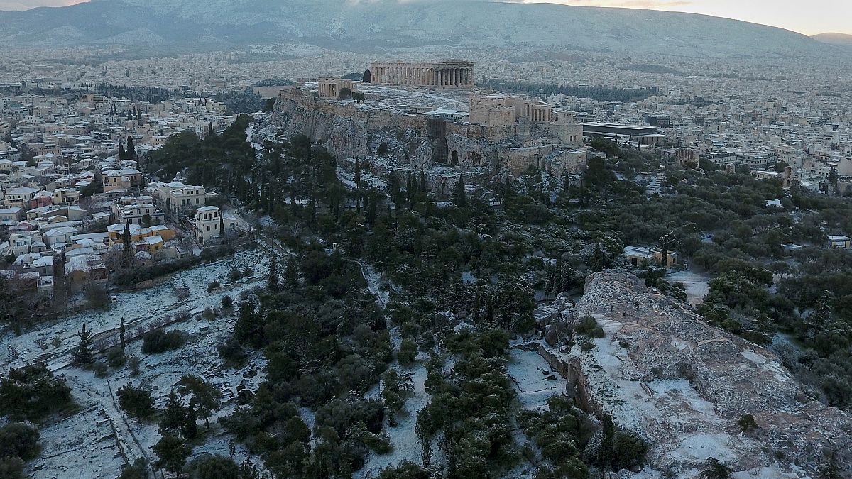 Watch: Athens awakes to winter wonderland