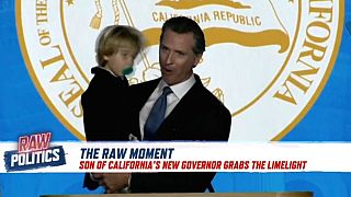 Raw Moment: Child proves perfect prop to California Governor's inauguration speech