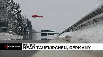 Helicopter propellers used to remove snow on trees in Bavaria