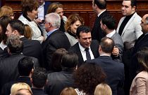Prime Minister Zoran Zaev greets MPs after the vote.