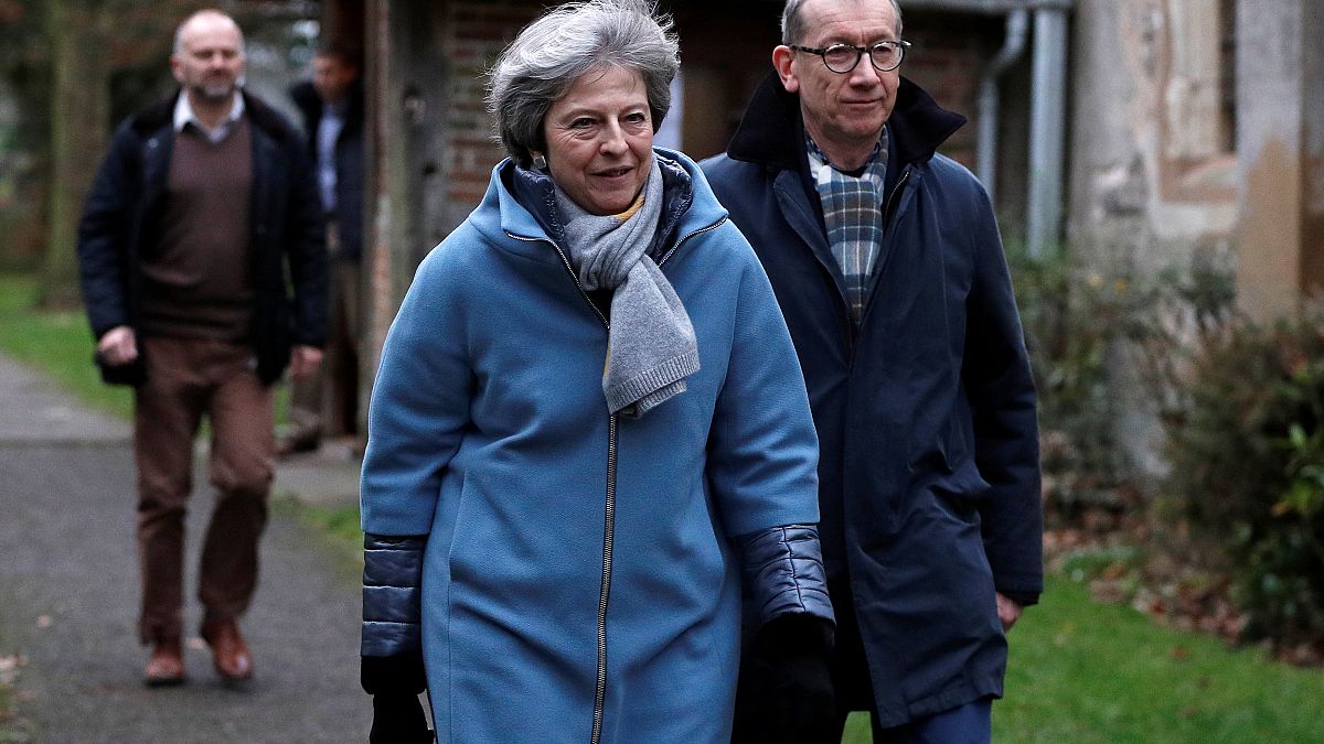 Theresa May leaves church near High Wycombe with husband Philip. 
