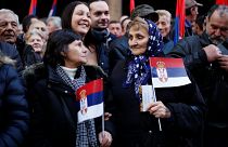Thousands gather in Belgrade to cheer Putin during his brief visit to Serbia