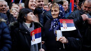 Thousands gather in Belgrade to cheer Putin during his brief visit to Serbia