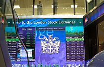 British stocks shrug off politics as results drive big moves