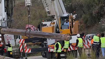 Engineers work to rescue a boy trapped down a borehole in southern Spain