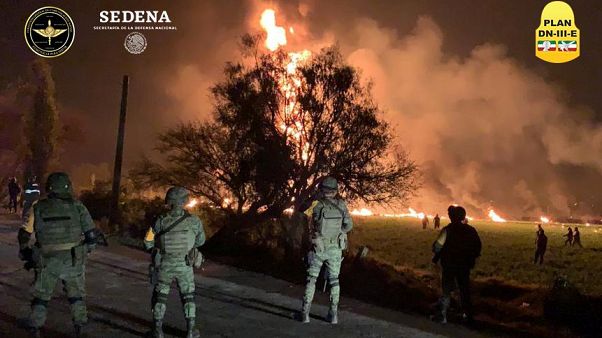 Soldiers attend a fire in Tlahuelilpan, Hidalgo, Mexico on Jan 19, 2019. Soldiers attend a fire in Tlahuelilpan, Hidalgo, Mexico on Jan 19, 2019.