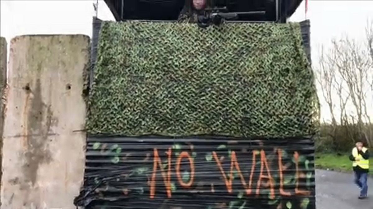 Raw Moment: Protesters dressed as soldiers create 'Brexit border wall' on island of Ireland