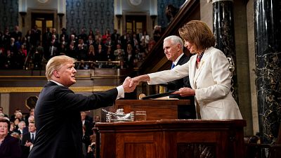 US President Donald Trump shakes hands with House Speaker Nancy Pelosi