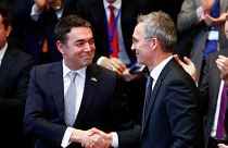 Macedonian FM Dimitrov shakes hands with NATO Secretary General Stoltenberg