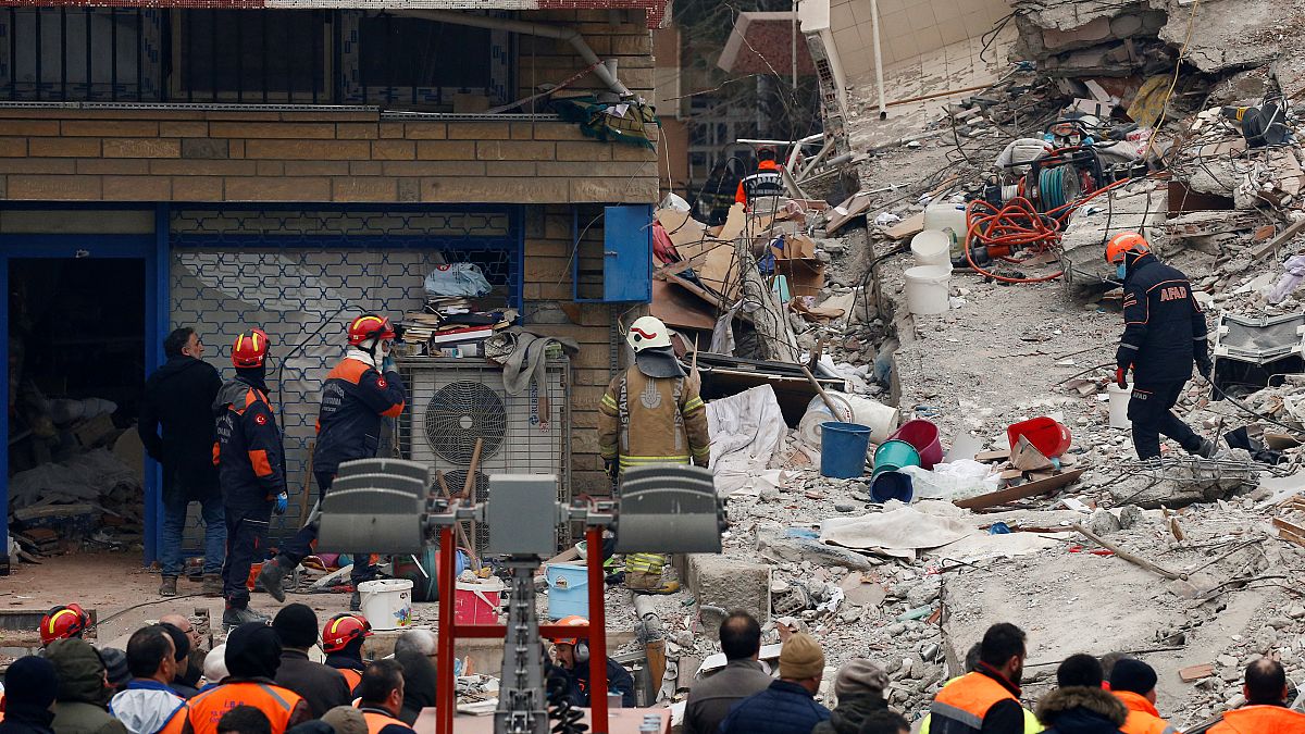 Rescue workers on the site of the building collapse in Istanbul