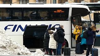 Passengers leave a bus in Finland