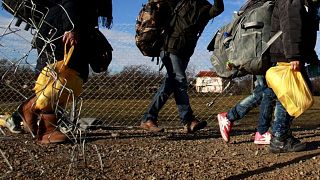 Refugees walk towards the Serbian border near the North Macedonian village of Tabanovce.