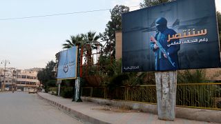  An IS billboard in Raqqa reads: 'We will win despite the global coalition'