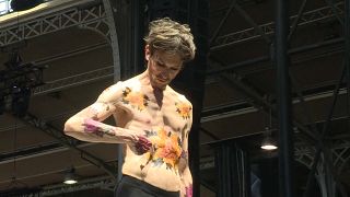 Body art and dance meet at Paris tattoo fair