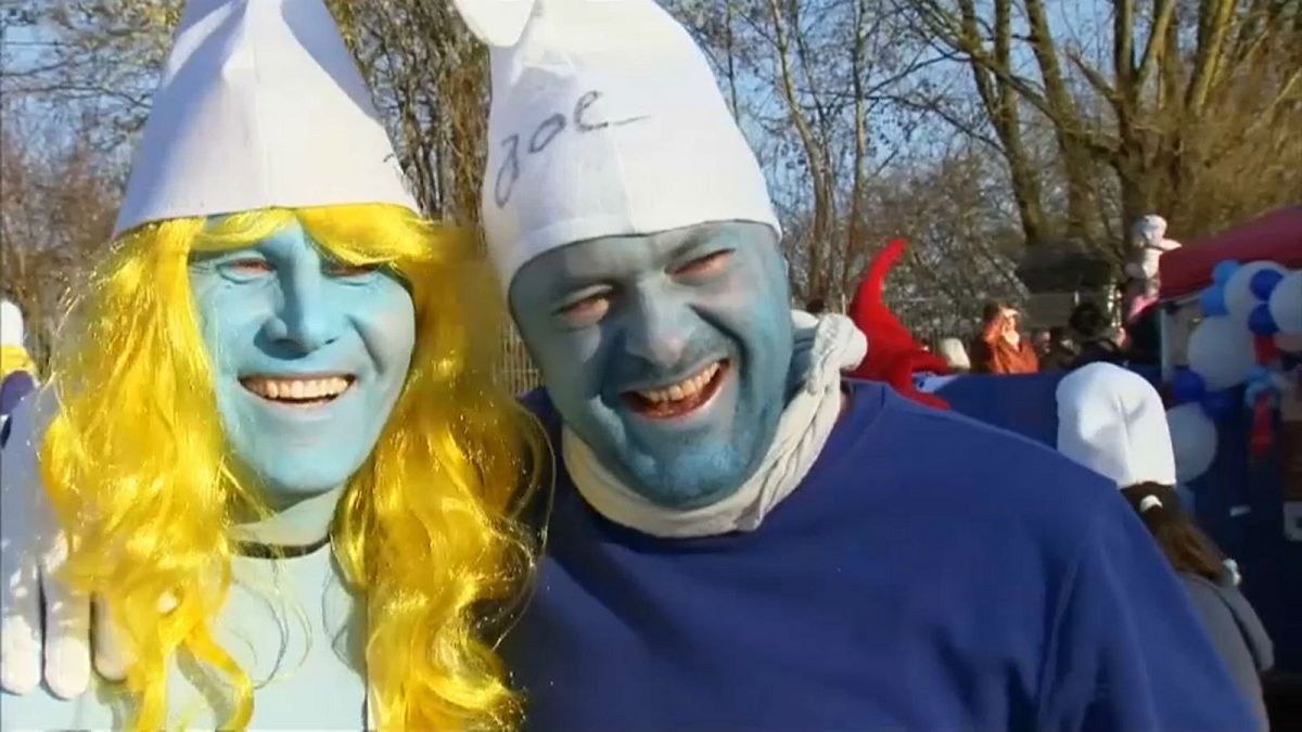 Participants of a bid to break the record for the largest Smurfs meeting