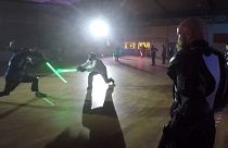 Duelling takes place in the dark with replica lightsabers