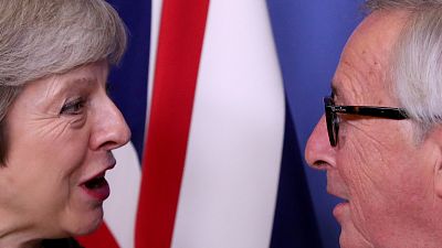 UK Prime Minister Theresa May with the EU's Jean-Claude Juncker