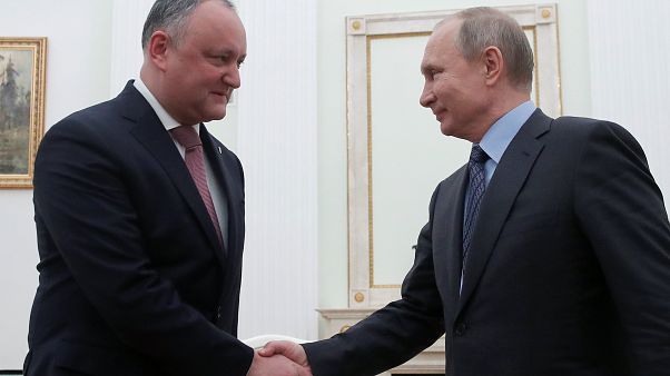 Moldovan president Igor Dodon shakes hands with Vladimir Putin Moldovan president Igor Dodon shakes hands with Vladimir Putin