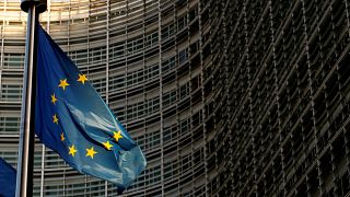 EU flag is seen outside the EU Commission headquarters in Brussels