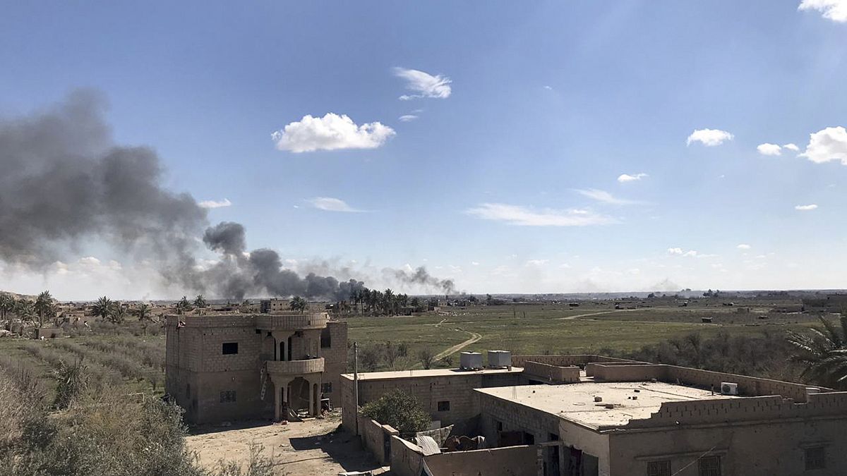 Black smoke rises from the last piece of territory held by ISIS in Syria 