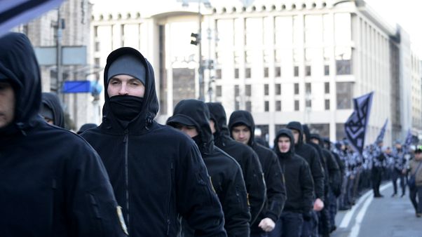 Andriy Biletsky, leader of the National Corps (centre), with the activists Andriy Biletsky, leader of the National Corps (centre), with the activists