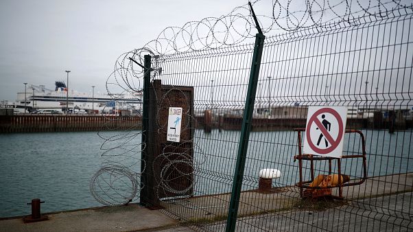 P&O cross-Channel ferry seen through razor wired security fence in Calais. P&O cross-Channel ferry seen through razor wired security fence in Calais.