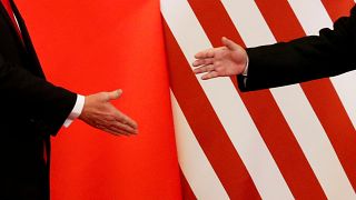 U.S. President Donald Trump and China's President Xi Jinping shake hands