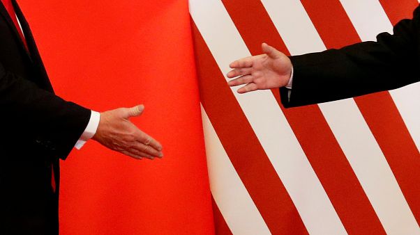 U.S. President Donald Trump and China's President Xi Jinping shake hands U.S. President Donald Trump and China's President Xi Jinping shake hands