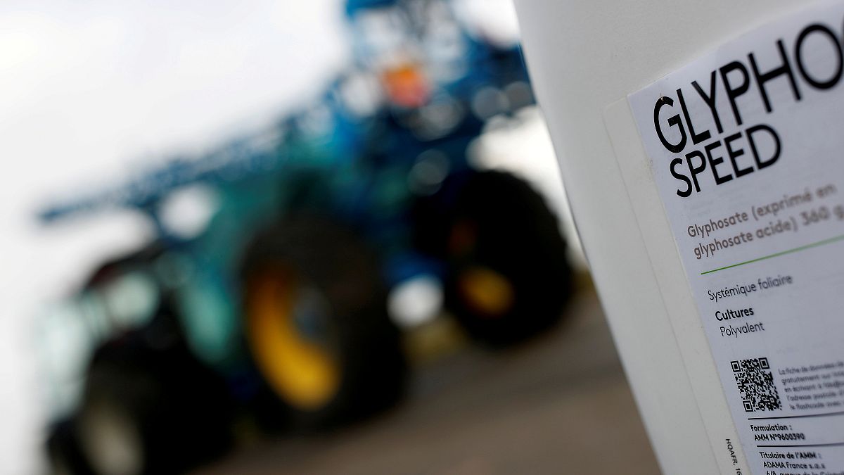 File picture: A can of glyphosate weedkiller is seen in front of a tractor 