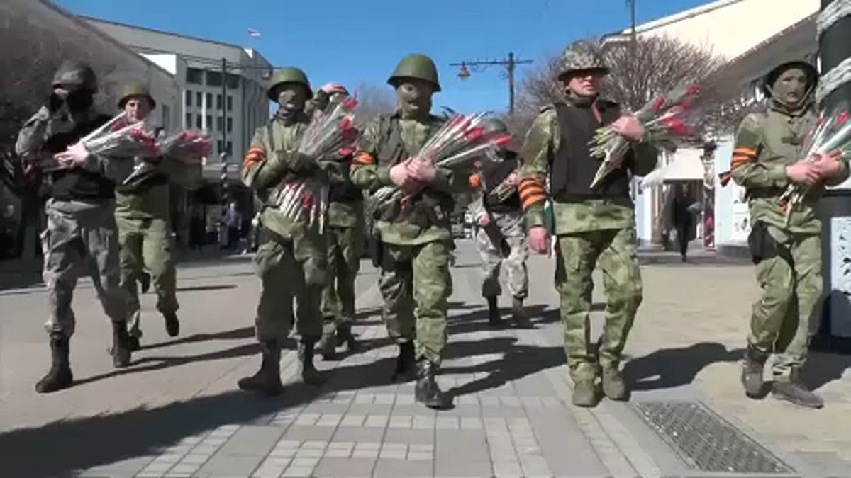 Crimea marks Women's Day with combat gear and flowers